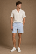 Acentino Striped Shorts in White with French Blue Stripes on model - front pose