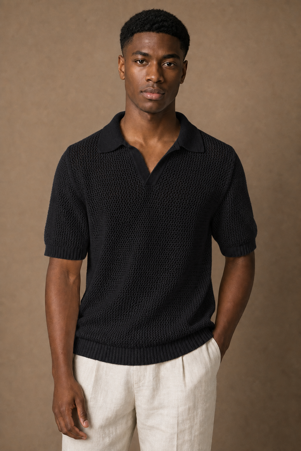 Aria Knitted Polo Shirt in Black on model — front pose