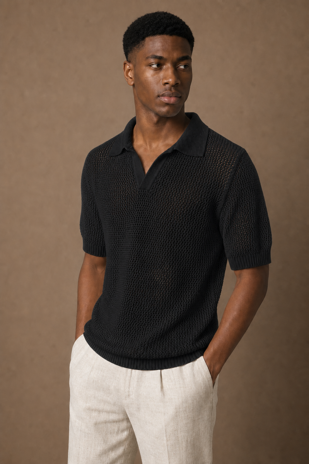 Aria Knitted Polo Shirt in Black on model — alternate pose