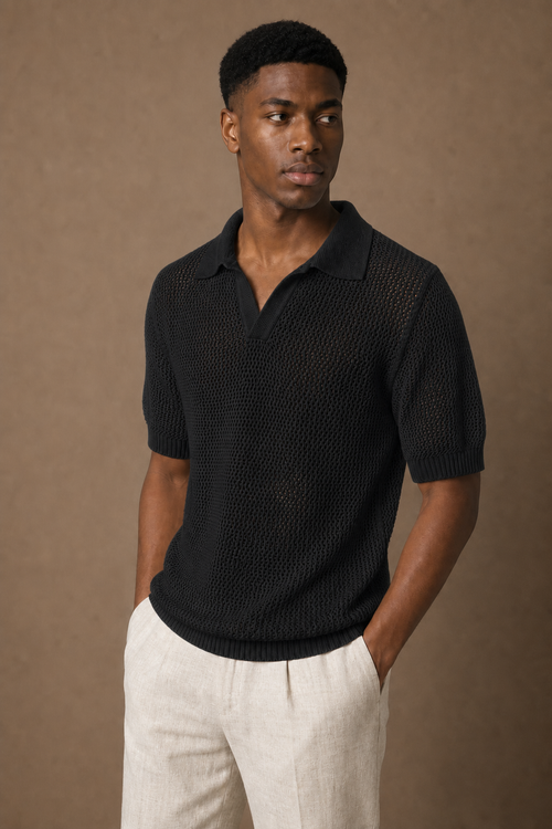 Aria Knitted Polo Shirt in Black on model — alternate pose