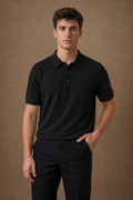 Torcello Knitted Polo Shirt in Black on model — front pose